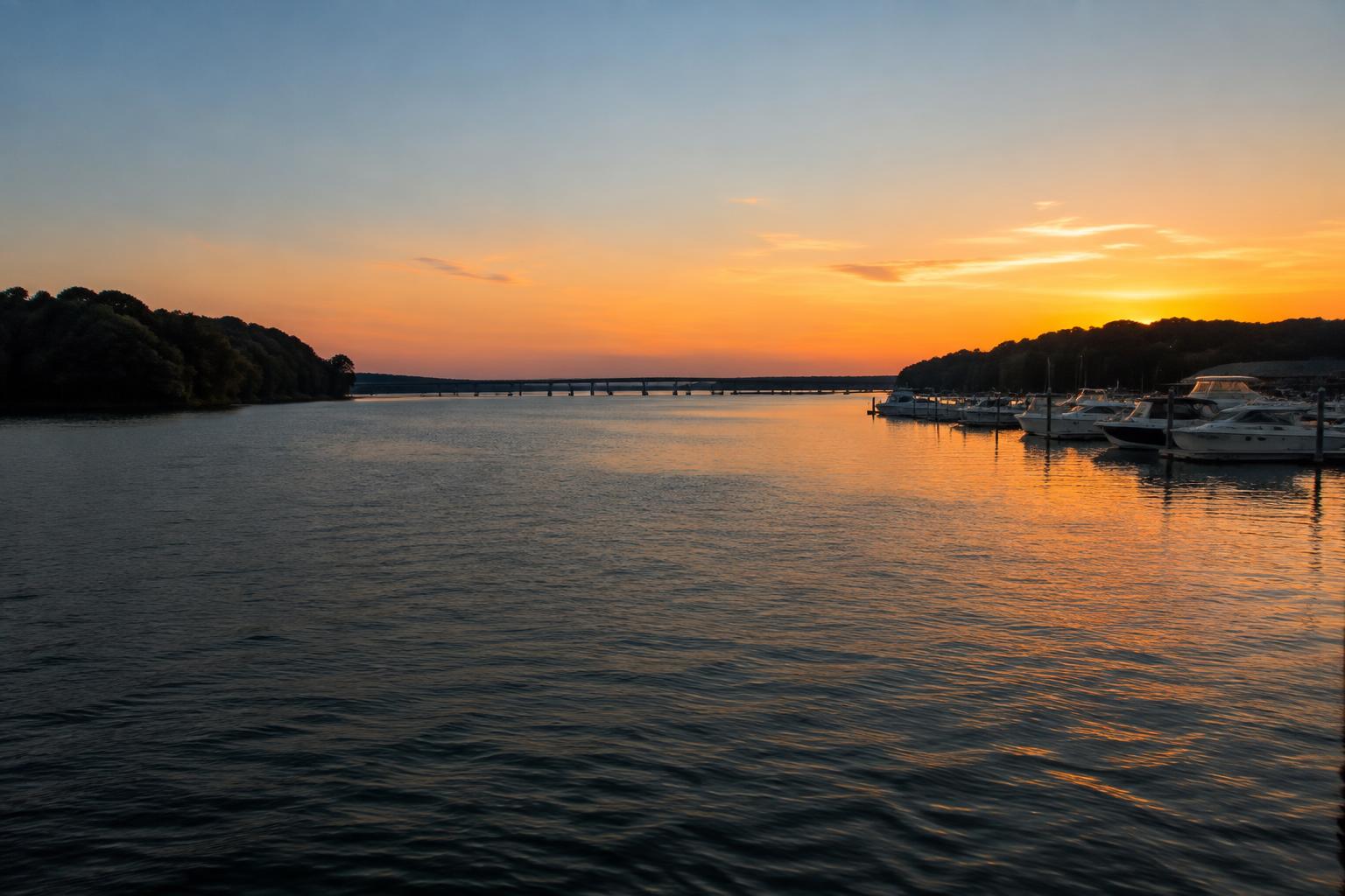 Open Lake Norman main channel with a marina at sunset